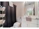 Cozy bathroom featuring white fixtures and a practical shower curtain at 905 Attaway Rd, Bowdon, GA 30108