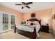 Relaxing bedroom with ceiling fan, french doors to patio, and neutral color palette at 905 Attaway Rd, Bowdon, GA 30108