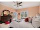 Comfortable primary bedroom with view of ensuite bath, large bed, and dark wood furniture at 905 Attaway Rd, Bowdon, GA 30108