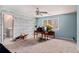 Spacious bedroom with a ceiling fan and windows at 905 Attaway Rd, Bowdon, GA 30108