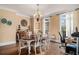 Elegant dining room with a classic chandelier and neutral walls, ideal for entertaining at 905 Attaway Rd, Bowdon, GA 30108