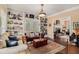 Cozy living room with built-in bookshelves, providing storage and display space at 905 Attaway Rd, Bowdon, GA 30108