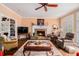 Relaxing living room with a stone fireplace, creating a warm and inviting atmosphere at 905 Attaway Rd, Bowdon, GA 30108