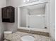 Well-lit bathroom with granite vanity, decorative mirror and medicine cabinet at 164 Adrian Dr, Stockbridge, GA 30281
