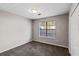 Cozy bedroom featuring neutral paint, carpeted floor, window, and closet at 164 Adrian Dr, Stockbridge, GA 30281