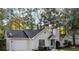 Charming single-story home featuring a well-manicured front yard and attached garage at 164 Adrian Dr, Stockbridge, GA 30281