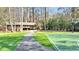 Outdoor basketball court with seating and green space, perfect for sports and relaxation at 2480 Roxburgh Dr, Roswell, GA 30076