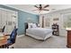 Comfortable bedroom with a study desk and a built in mirror doored wardrobe closet at 2480 Roxburgh Dr, Roswell, GA 30076