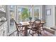 Bright breakfast nook features a bay window with views of the deck and backyard at 2480 Roxburgh Dr, Roswell, GA 30076