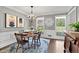 Elegant dining room with wood floors, chandelier, artwork, and plenty of natural light at 2480 Roxburgh Dr, Roswell, GA 30076
