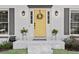 Close up of front door with decorative wreath and potted plants at 2480 Roxburgh Dr, Roswell, GA 30076