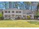 Charming two-story home with a well-manicured lawn and a welcoming front entrance at 2480 Roxburgh Dr, Roswell, GA 30076
