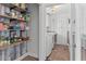 Pantry and laundry room combination with shelves and a washer and dryer at 2480 Roxburgh Dr, Roswell, GA 30076