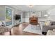 Comfortable living room featuring a piano, a patterned rug, and lots of natural light at 2480 Roxburgh Dr, Roswell, GA 30076