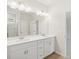 Bright bathroom features a double sink vanity, white cabinets, and ample lighting at 28 Kensington St, Kingston, GA 30145