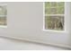 Bright bedroom featuring two windows with views of the surrounding greenery at 28 Kensington St, Kingston, GA 30145