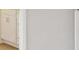Clean hallway with white walls and trim, offering seamless transition between rooms at 28 Kensington St, Kingston, GA 30145