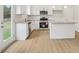 Bright kitchen with stainless steel appliances, granite countertops, and a center island at 28 Kensington St, Kingston, GA 30145