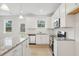 Modern kitchen with stainless steel appliances, granite countertops, and bright pendant lighting at 28 Kensington St, Kingston, GA 30145
