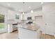 Well-lit kitchen featuring stainless steel appliances, granite countertops, and a center island at 28 Kensington St, Kingston, GA 30145