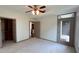 Bedroom features a walk-in closet, carpet, and a door leading to a balcony at 390 17Th Nw St # 4037, Atlanta, GA 30363