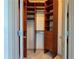 Custom walk-in closet with built-in shelves, drawers, and ample hanging space at 390 17Th Nw St # 4037, Atlanta, GA 30363