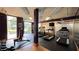 Well-equipped gym with modern machines, free weights, and a mirrored wall for convenient and effective workouts at 390 17Th Nw St # 4037, Atlanta, GA 30363