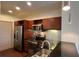 Well-equipped kitchen with stainless steel appliances and dark countertops at 390 17Th Nw St # 4037, Atlanta, GA 30363