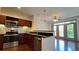 Modern kitchen featuring stainless steel appliances and dark wood cabinetry at 390 17Th Nw St # 4037, Atlanta, GA 30363