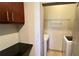 Laundry room with modern appliances and a granite countertop at 390 17Th Nw St # 4037, Atlanta, GA 30363