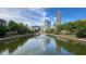 Picturesque pond view reflecting the city skyline, creating a tranquil urban oasis with natural beauty at 390 17Th Nw St # 4037, Atlanta, GA 30363