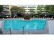 Refreshing pool featuring lounge chairs and a serene fountain for relaxation and enjoyment at 390 17Th Nw St # 4037, Atlanta, GA 30363