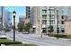 Street view showing the building and the surrounding urban landscape, convenient to businesses at 390 17Th Nw St # 4037, Atlanta, GA 30363