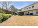 Spacious backyard featuring a private, screened in patio with a lush green backdrop at 5 Burns View Ct, Lawrenceville, GA 30044