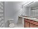Bright bathroom features a sleek vanity with stone countertop, and tiled floors at 5 Burns View Ct, Lawrenceville, GA 30044