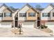 Charming townhome showcasing brick accents, a one-car garage, and a meticulously maintained front yard at 5 Burns View Ct, Lawrenceville, GA 30044