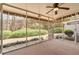 Screened-in porch features ample natural light and views of landscaped backyard at 5 Burns View Ct, Lawrenceville, GA 30044