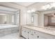 Open Primary bath with marble floors, granite countertops, dual vanity, and view to soaking tub at 906 John Ct, Lawrenceville, GA 30046