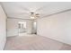 Bedroom with neutral carpeting leads to en-suite bathroom, creating a convenient and private space at 906 John Ct, Lawrenceville, GA 30046