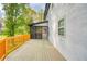 Exterior view of the spacious deck, ideal for outdoor entertaining, with a screened porch at 906 John Ct, Lawrenceville, GA 30046