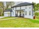 Beautifully landscaped front yard leading to a charming two-story home at 906 John Ct, Lawrenceville, GA 30046
