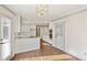 Bright kitchen with white cabinets, granite countertops and stainless steel oven at 906 John Ct, Lawrenceville, GA 30046