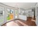 Sun-filled kitchen with white cabinets, granite countertops, stainless appliances and island at 906 John Ct, Lawrenceville, GA 30046