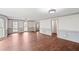 Spacious living room features hardwood floors, fresh paint, and natural light from large windows at 906 John Ct, Lawrenceville, GA 30046