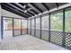 The screened porch is the perfect place to relax and take in the surrounding nature at 906 John Ct, Lawrenceville, GA 30046