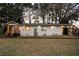 Well-maintained single-story home with manicured lawn, modern garage door, and covered entry at 1970 Capri Dr, Decatur, GA 30032