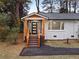 Charming front porch with wood columns, modern door, and stone accents at 1970 Capri Dr, Decatur, GA 30032