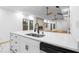 Open kitchen design with stainless steel sink, white countertop, and living room view at 1970 Capri Dr, Decatur, GA 30032