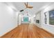 Spacious living room with hardwood floors, fireplace, and an open view to the kitchen at 1970 Capri Dr, Decatur, GA 30032