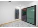 Bright, minimalist room with large sliding glass doors leading to an outdoor deck at 1970 Capri Dr, Decatur, GA 30032